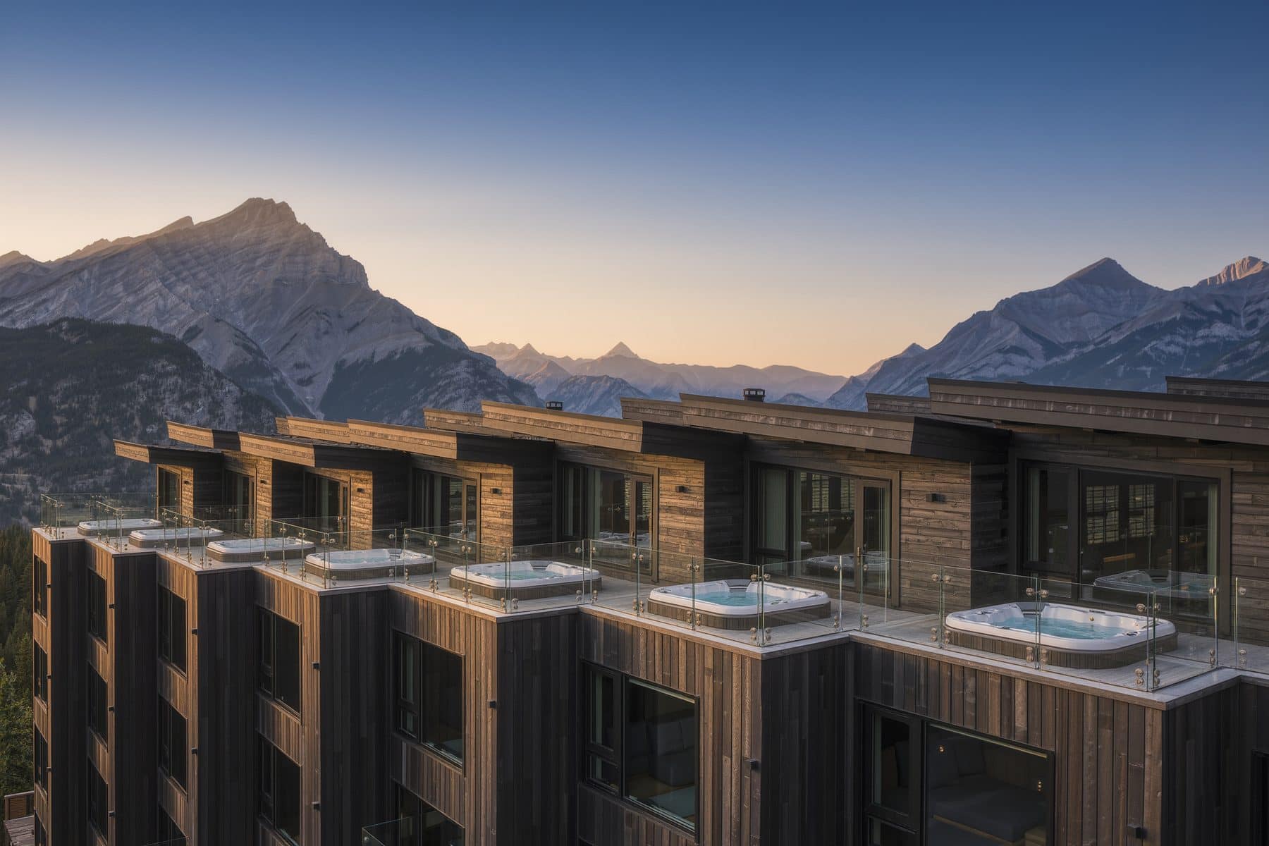 Basecamp Resorts, Canmore: modern resort building with rooftop hot tubs