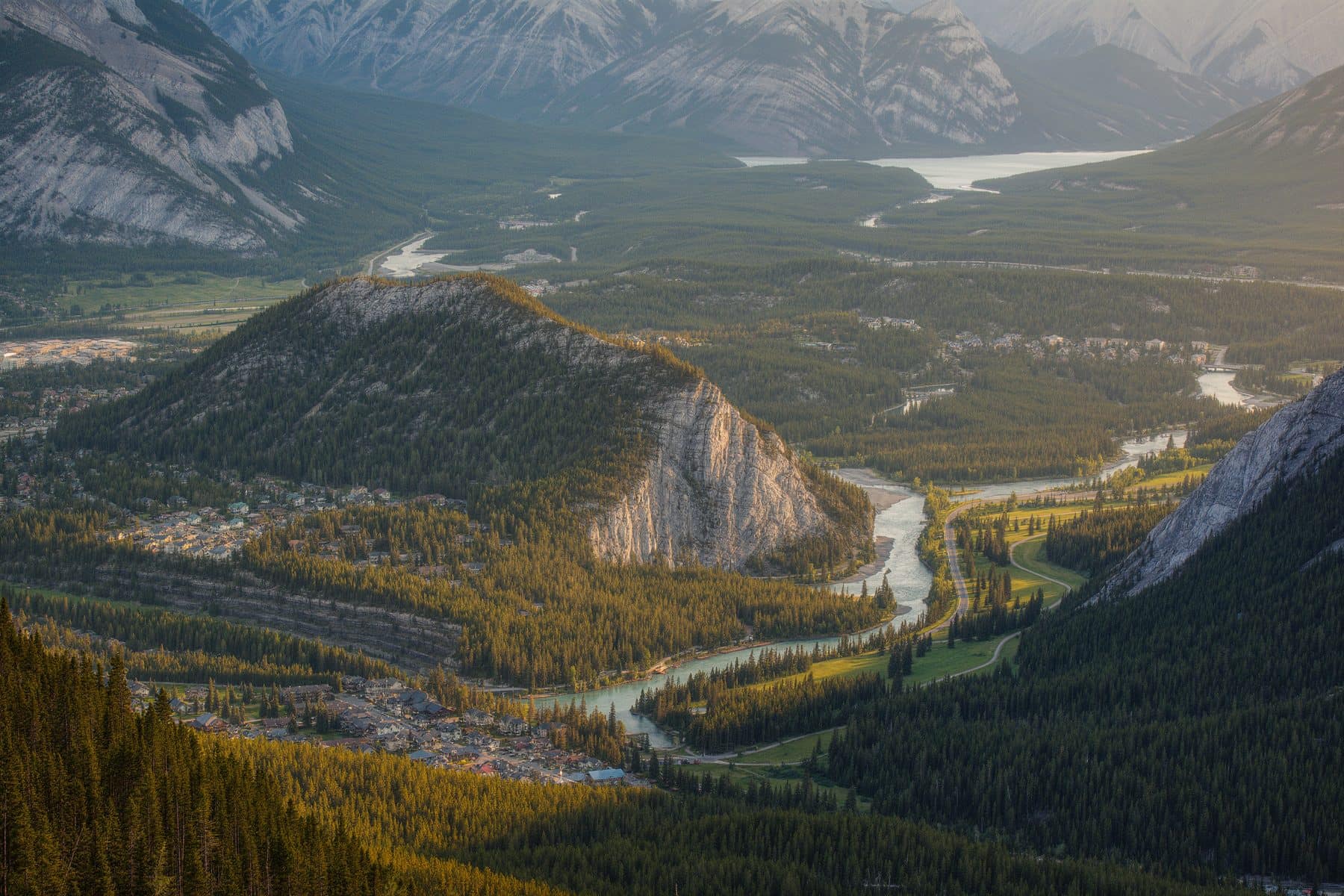 Canmore neighbourhoods from above: distinct pockets of housing between forest and river