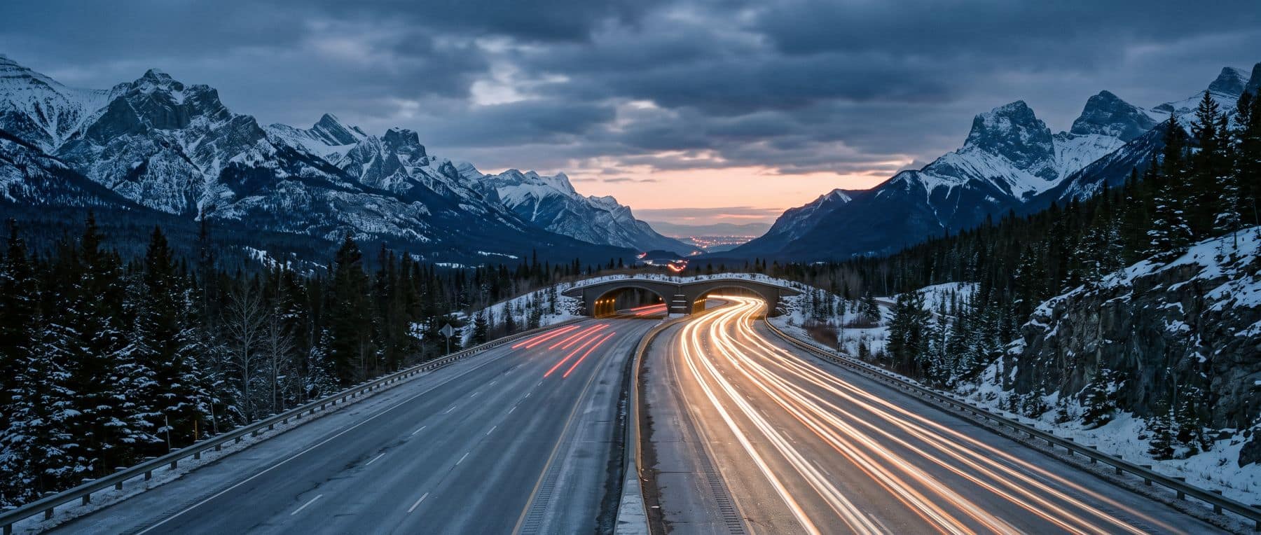 The Canmore to Calgary commute: headlights heading east down the highway before sunrise