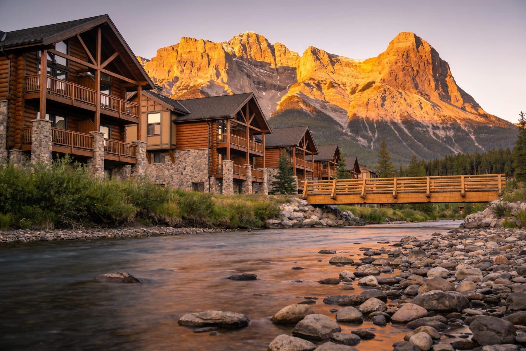 Spring Creek, Canmore: lodge buildings and the creek that gives the neighbourhood its name